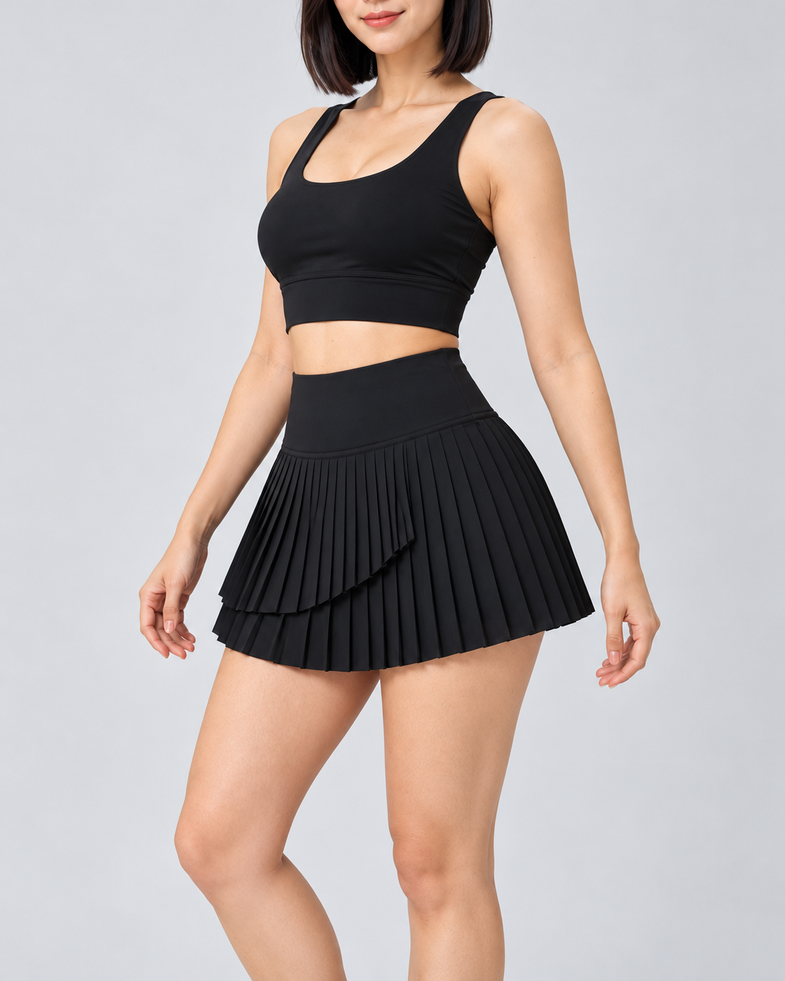 ARIA black pleated skort — three-quarter
