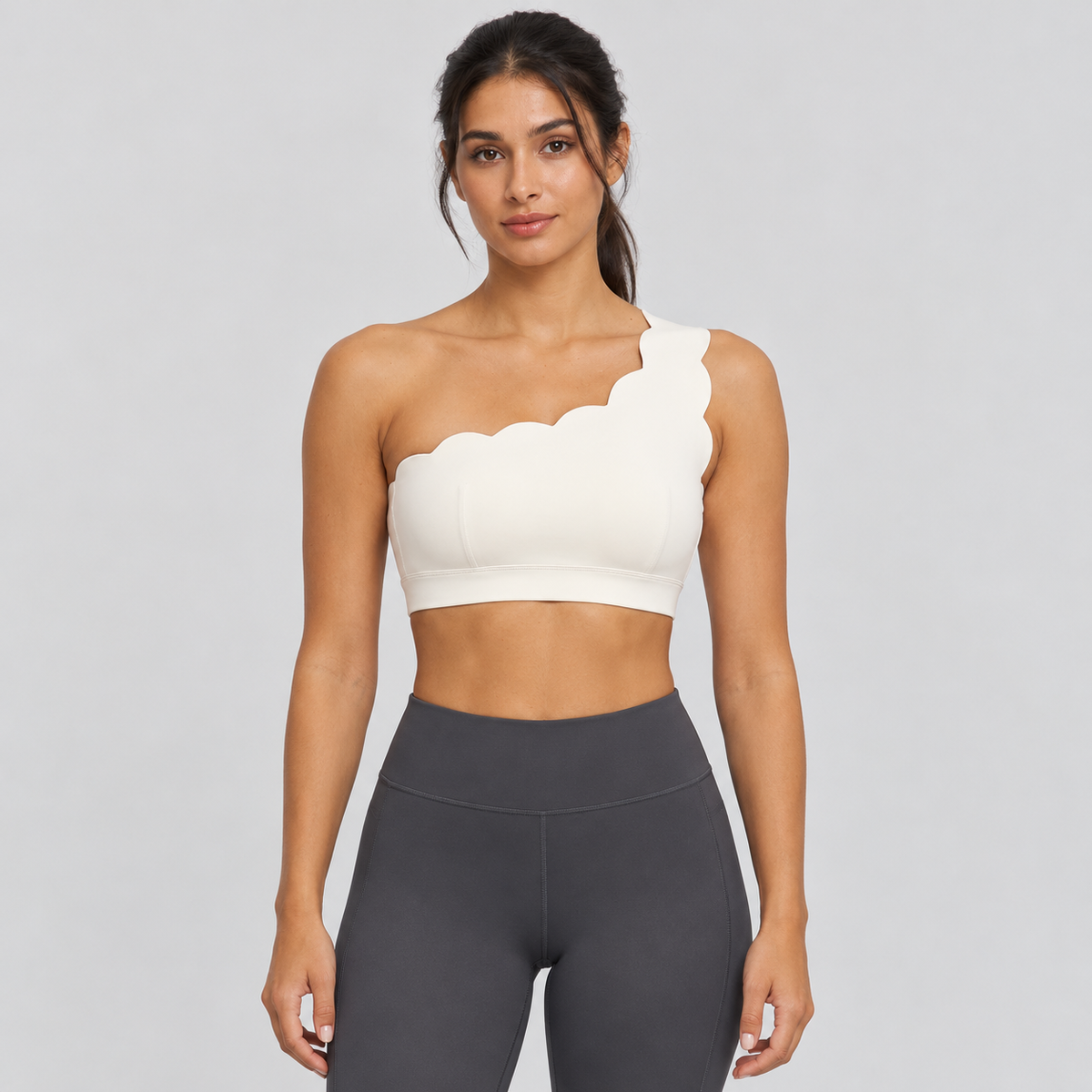 EMY Light Ivory one-shoulder sports bra - front view