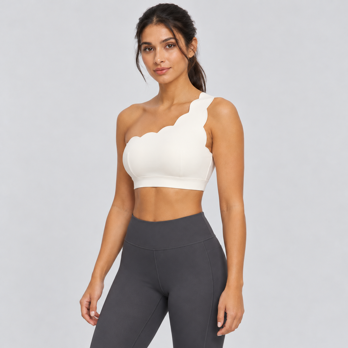 EMY Light Ivory one-shoulder sports bra - three-quarter view